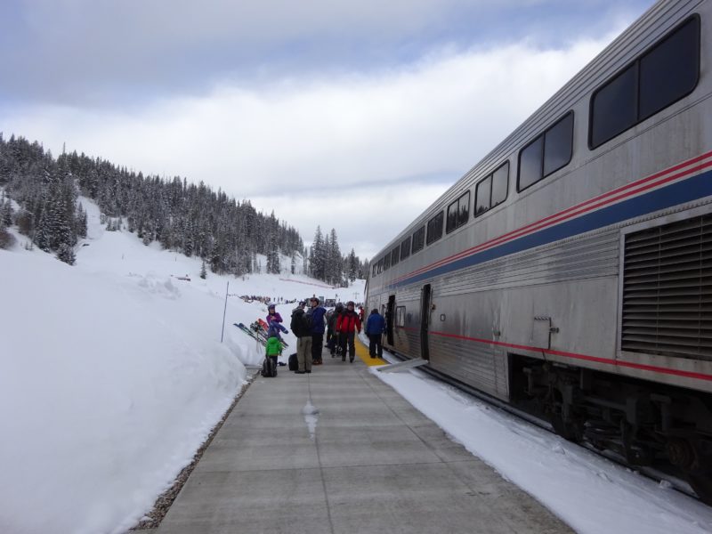 People unloading ski gear off the Winter Park Express