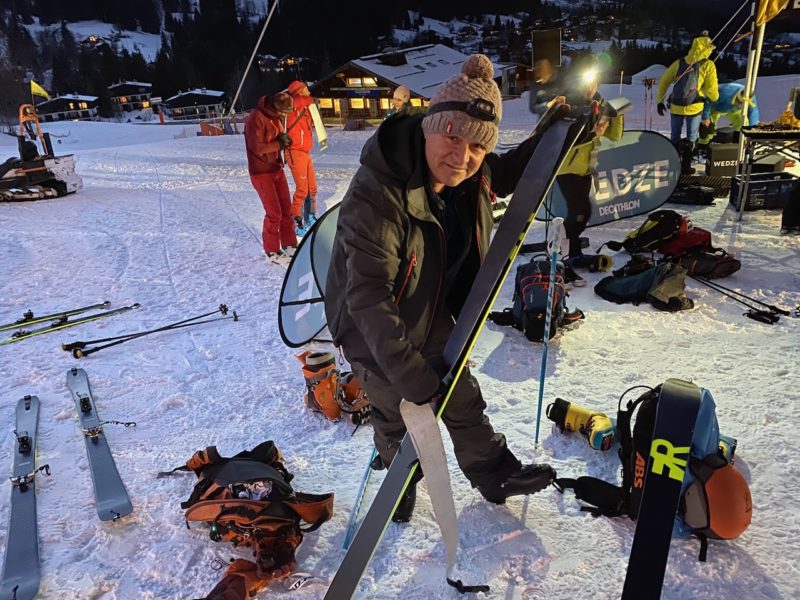 PlanetSKI Editor James Cove putting skins on some touring skis. He's preparing for night skiing