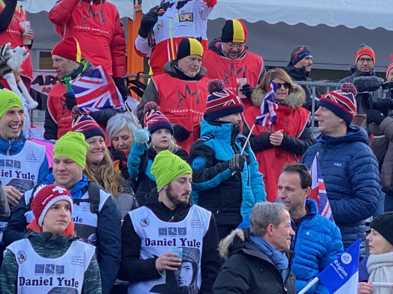 Fan zone in Chamonix with a group of supporters waving the british flag